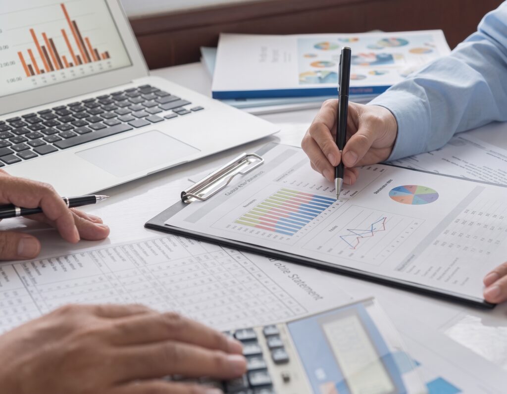 Financial adviser reviewing investment reports following pension investment loss