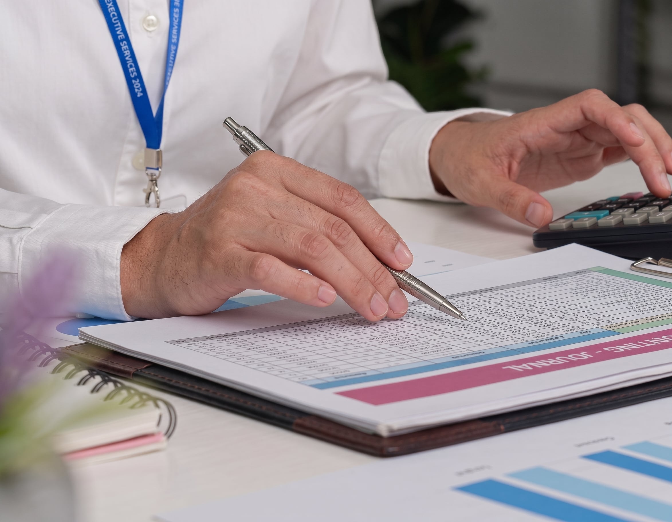 Financial adviser reviewing investment documents for a client changing financial adviser in retirement